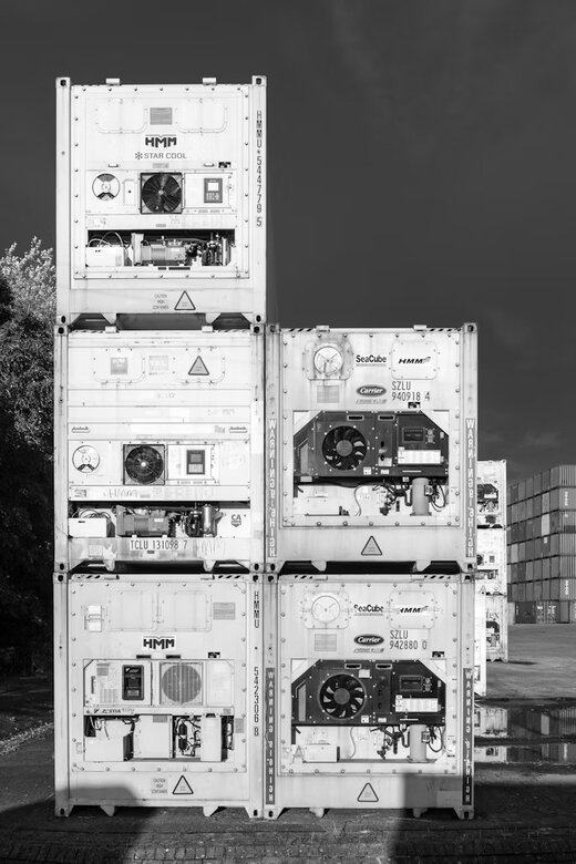 Stacked refrigerated shipping containers used to transport frozen meat